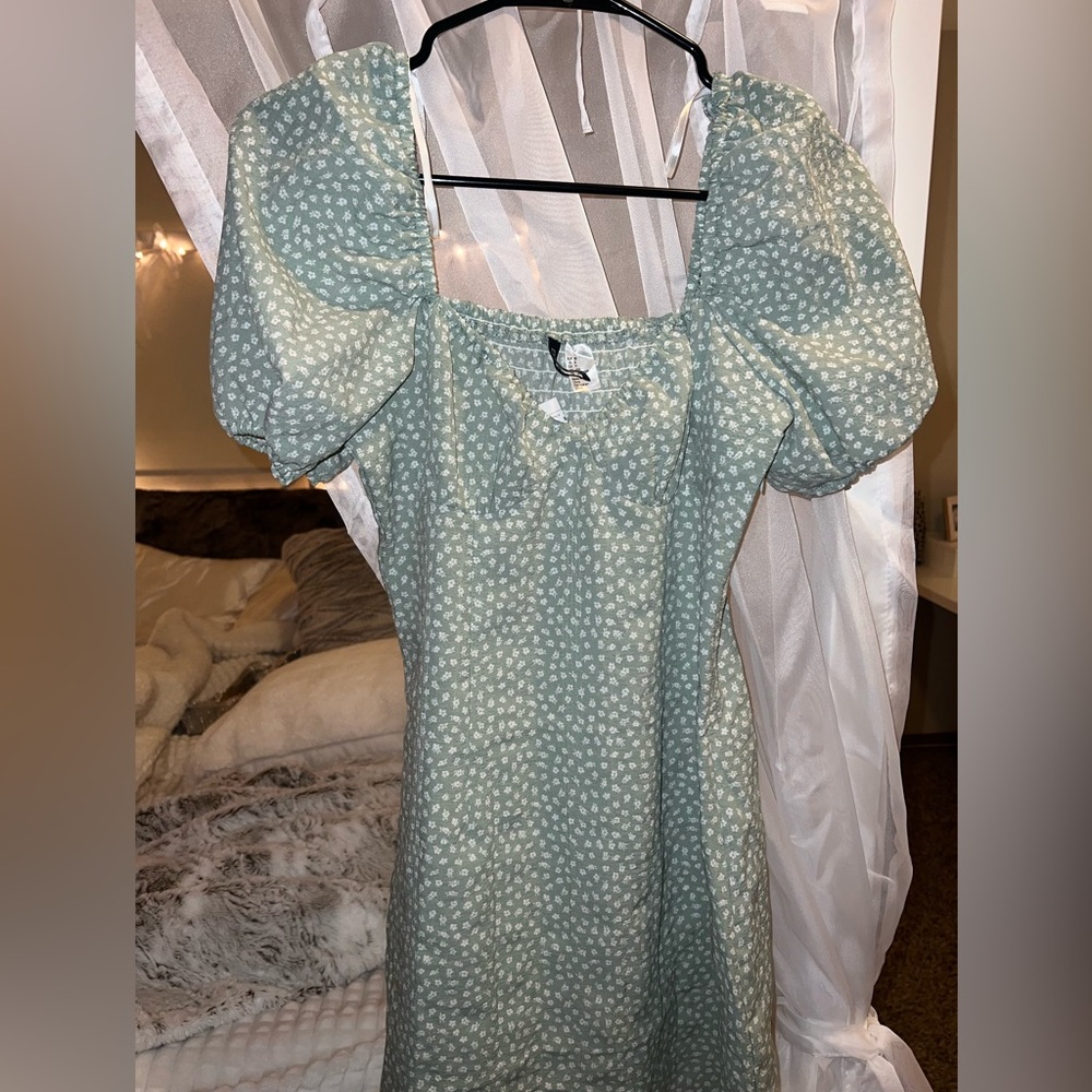 Light green sun dress w white polka dots. Never worn, new with tags.